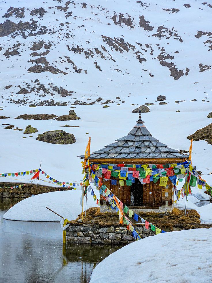 Guests at Kedarnath dham with mountains in the background